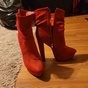 Red heeled boots. Worn once for a holiday party. Like new